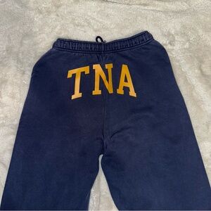 Navy and yellow TNA sweatpants